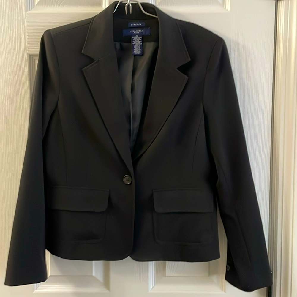 Black blazer/ suit jacket.